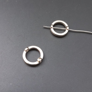 Korálek, mezikus, kruh, kovoplast,14 mm, barva platina (balení 60ks)