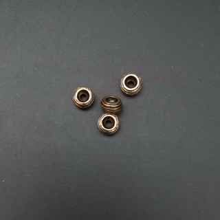 Korálek mezikus s vroubky 5x8 mm, barva staromosaz/ balení 100 ks