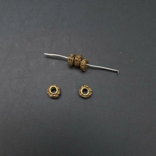Mezikus kroužek zdobený 7x3 mm, barva staromosaz / balení 60 ks