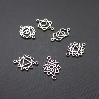 Mezikus čakry, cca 20x12mm, mix vzorů, barva platina / balení 10 ks