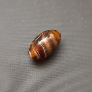 Korálky "vinuté", sklo, zlatohnědé, cca 20x12mm / balení 4 ks